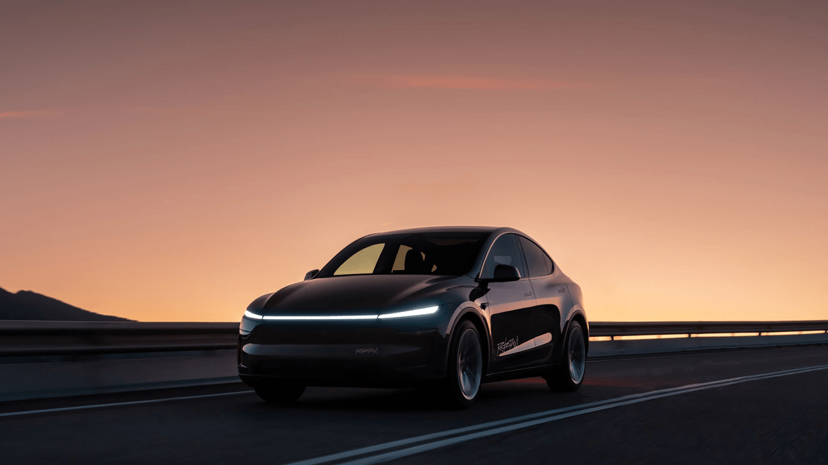 Tesla Model Y Robotaxi on a road at sunset — official Tesla Robotaxi image