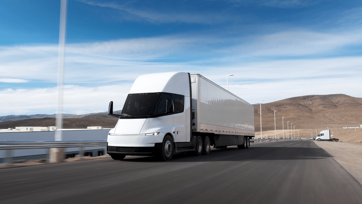 Tesla Semi driving with a trailer on a road near the Nevada factory