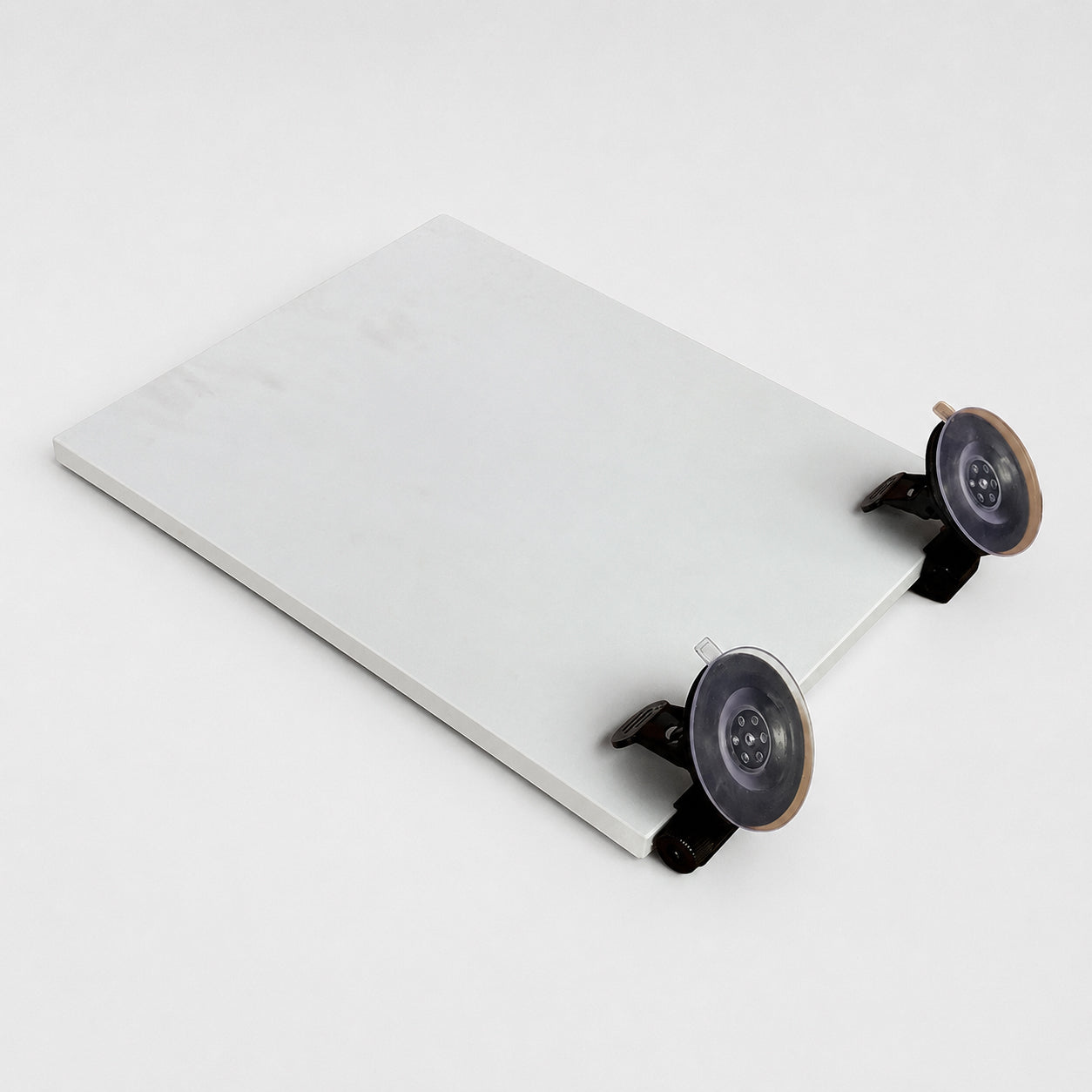 Starlink Mini dashboard windshield mount with dual suction cups attached to the device