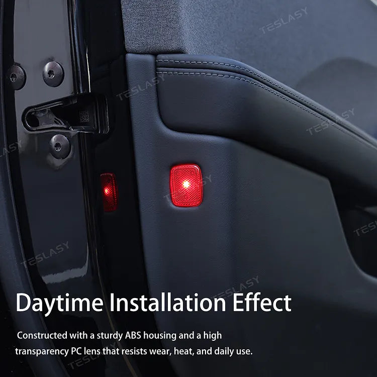 Daytime installation view of Tesla door warning light with ABS housing and clear PC lens