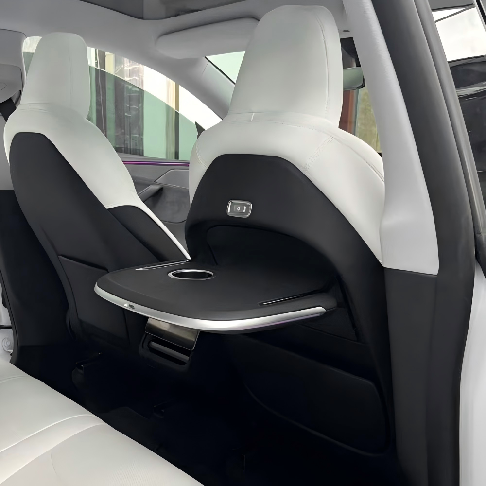 Electric folding rear-seat tray table installed in a Tesla