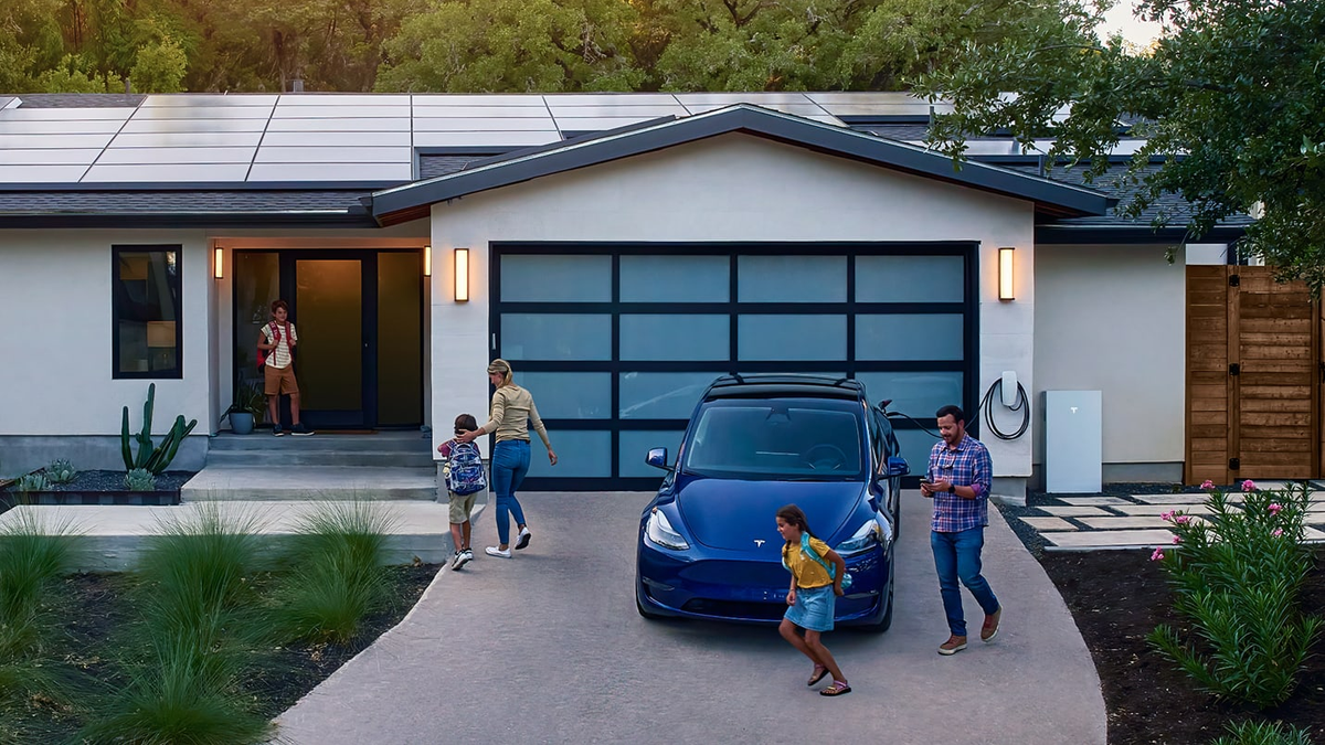 Tesla home with solar panels, Powerwall and an electric vehicle