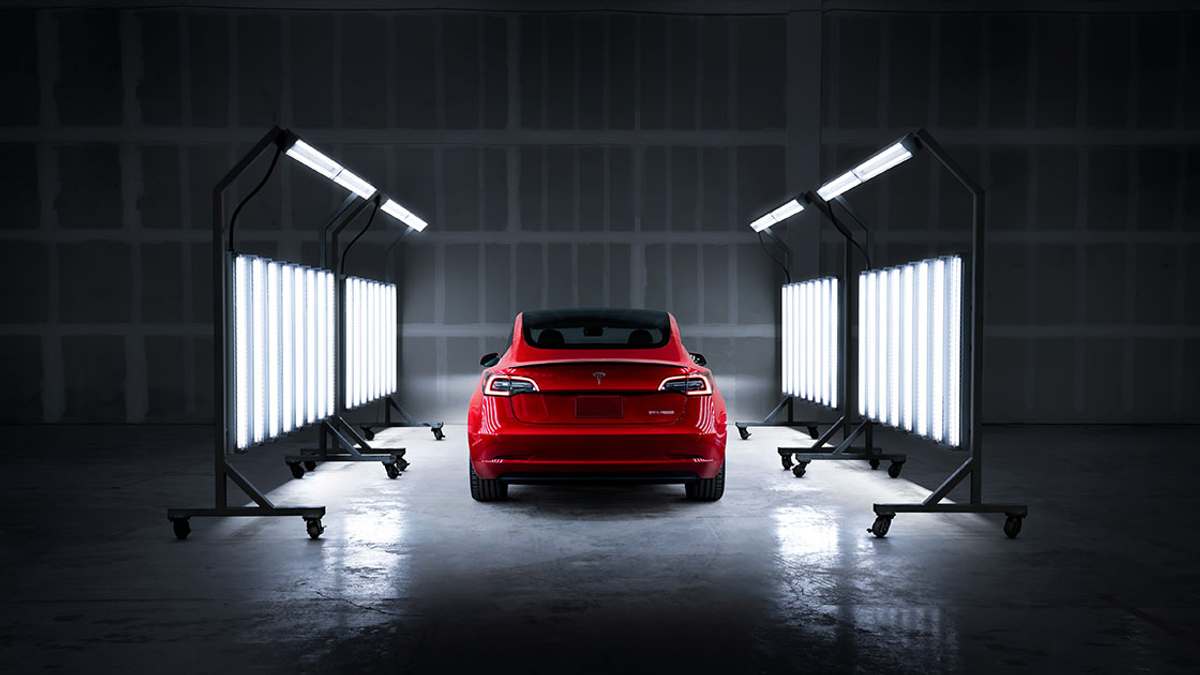 Tesla vehicle in an official Tesla Service inspection bay
