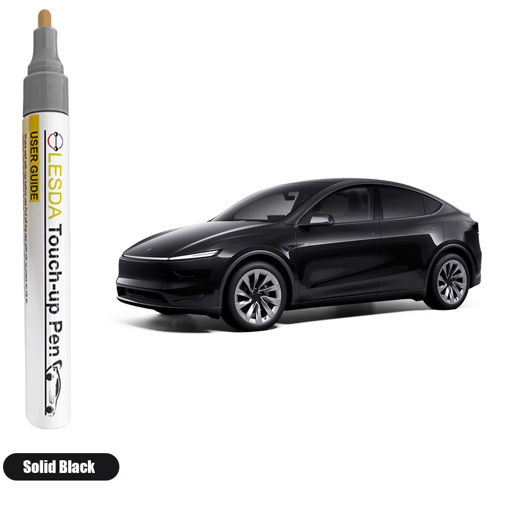 Black car with a LESDA touch-up pen on a white background