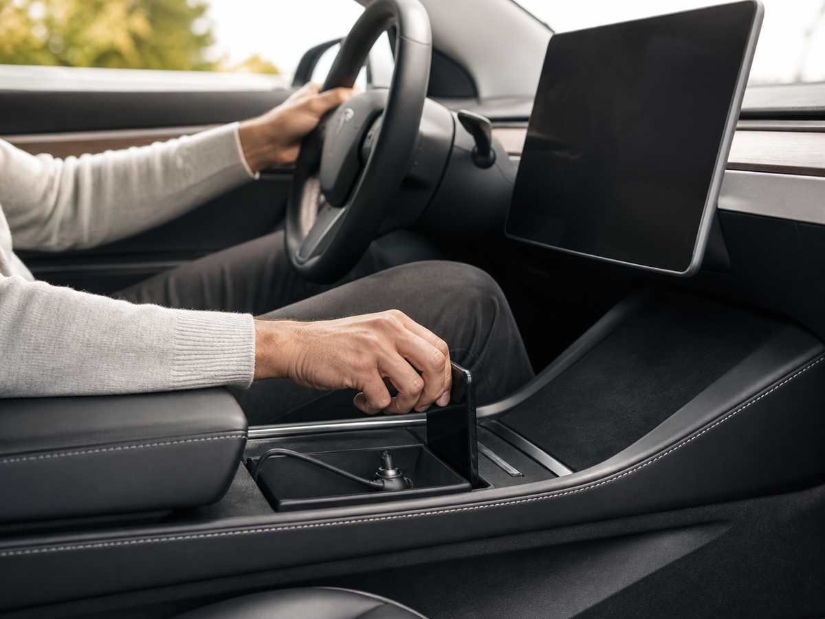 Driver using an integrated Tesla center console accessory