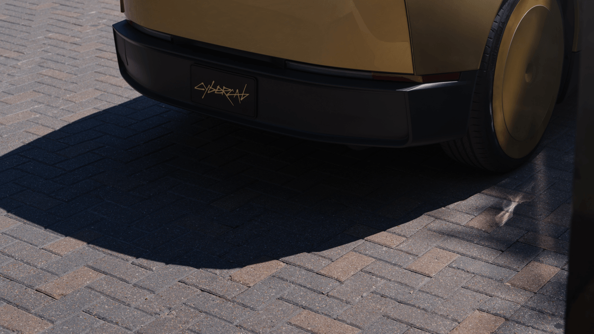 Gold Tesla Cybercab photographed for the official launch event rider promotion